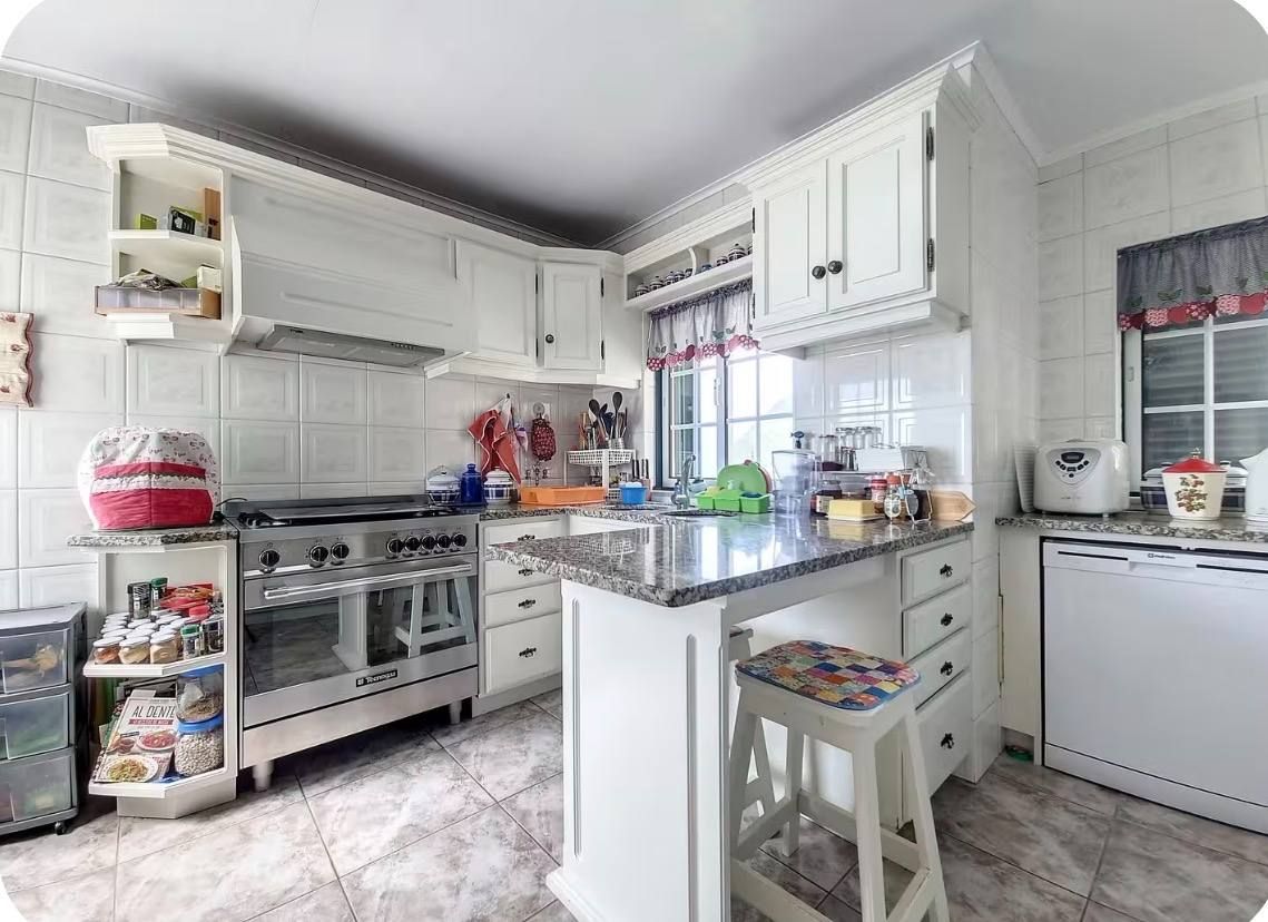 The kitchen with range cooker and breakfast counter