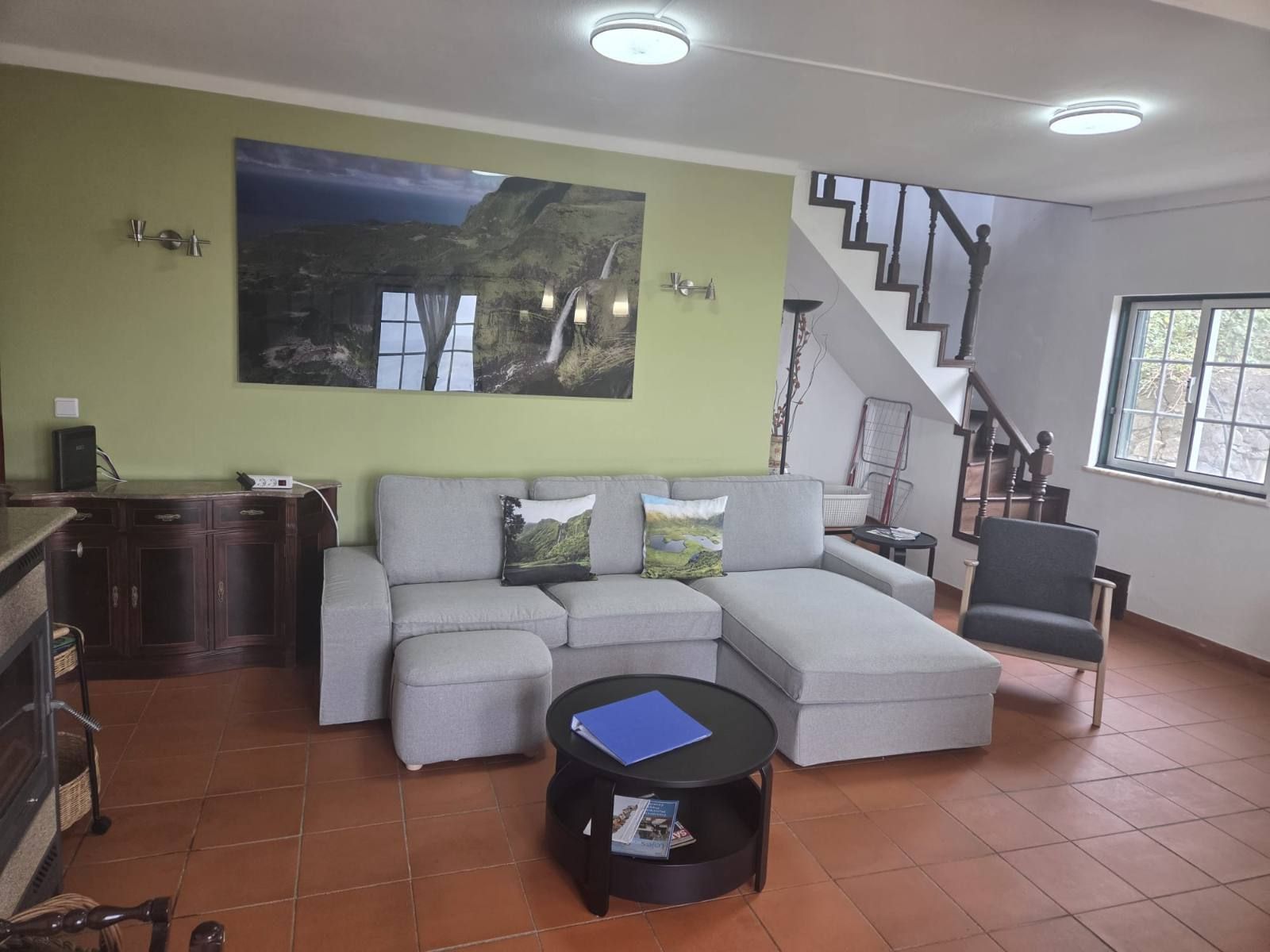 Living room 1, with sofas around the coffee table and the long dining table beyond